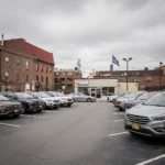 Car dealership lot in Pennsylvania urban setting with vehicles displayed for sale